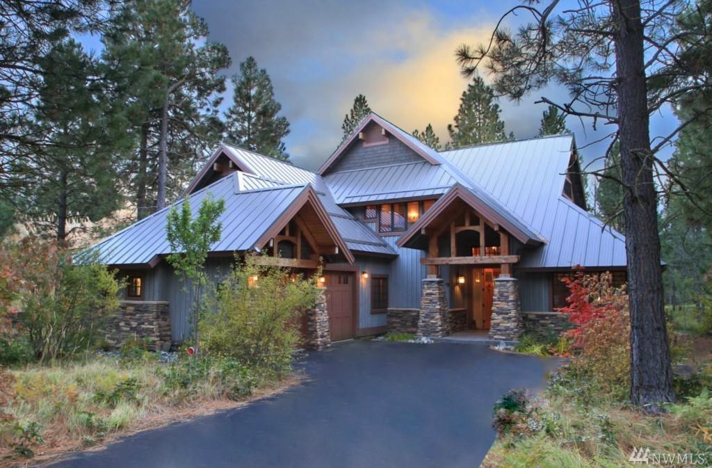 a large house in the middle of a forest.