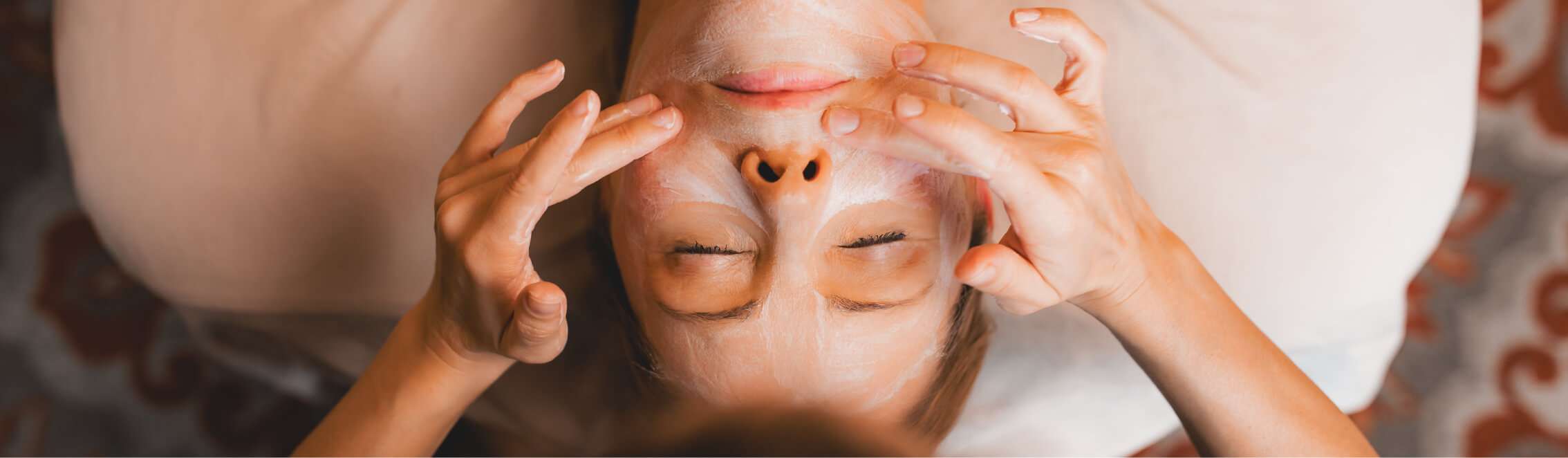 At Suncadia Resort in Washington, enjoy a rejuvenating facial massage with luxurious cream, eyes peacefully closed as gentle hands soothe your forehead and cheeks. Experience the ultimate relaxation amid the natural beauty that complements your visit to nearby Cle Elum restaurants.