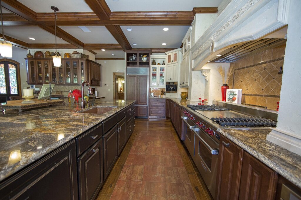 a kitchen with a stove top oven sitting inside of it.