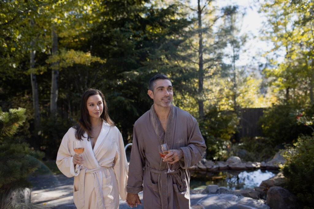 a man and a woman holding wine glasses.