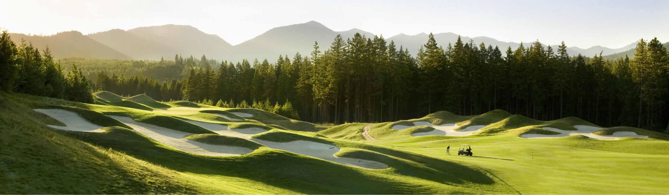 Nestled amid a dense forest, this golf course boasts sand bunkers in the foreground and a backdrop of majestic mountains. Just a stone's throw from Suncadia Resort Washington, it's perfect for those seeking both outdoor adventure and nearby dining at Cle Elum restaurants.