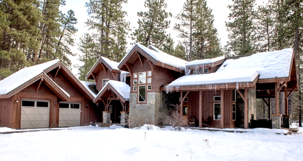 a large house with a lot of snow on the ground.