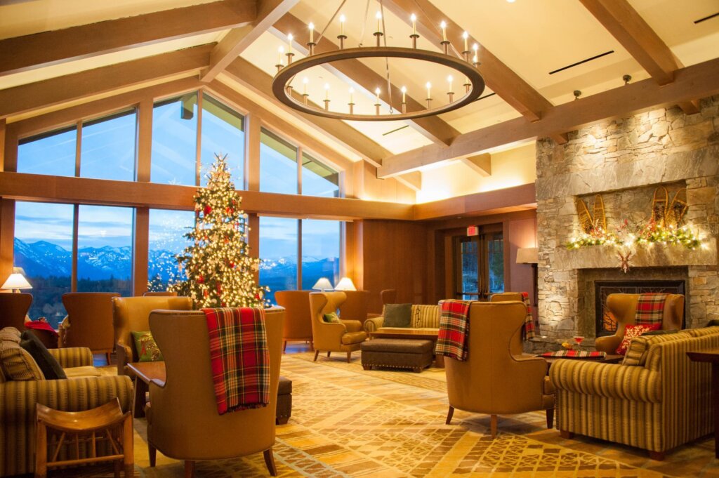 a living room filled with furniture and a christmas tree.