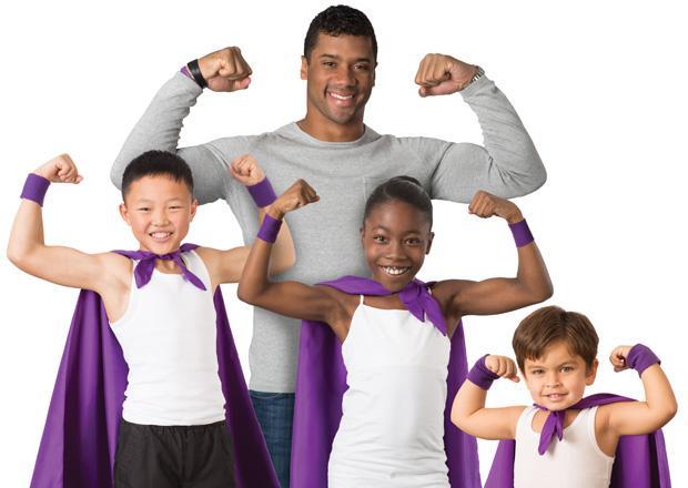 a man and two children wearing purple capes.