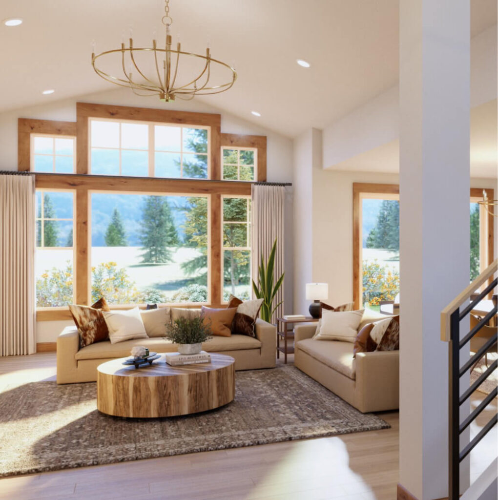 A bright living room with large windows, beige sofas, a round wooden coffee table, and a chandelier offers stunning views of trees and mountains at Suncadia Resort.