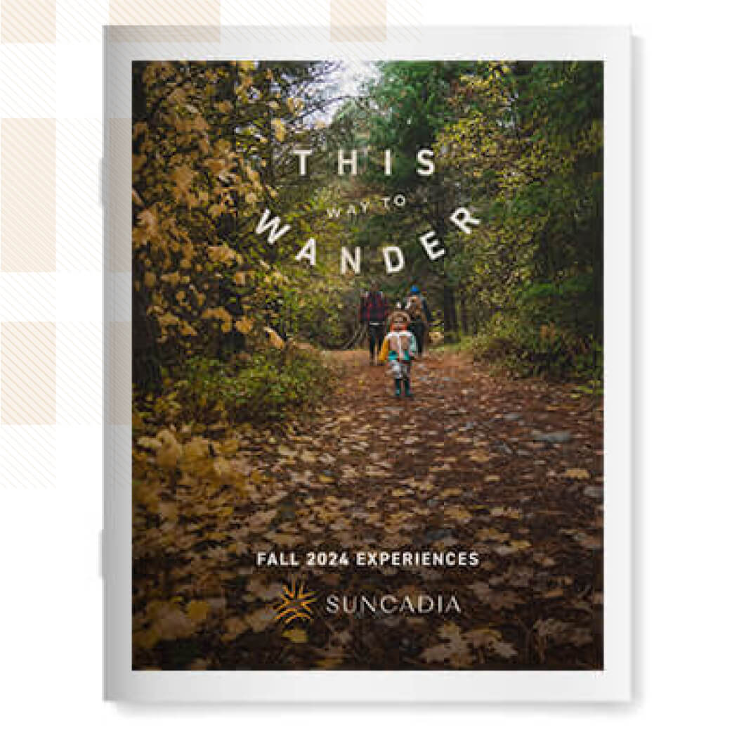 Brochure cover showing people walking on a forest path with fallen leaves. Text reads, "This Way to Wander. Fall 2024 Experiences at Suncadia Resort." Enjoy nearby Cle Elum restaurants and discover the charm of Suncadia homes.