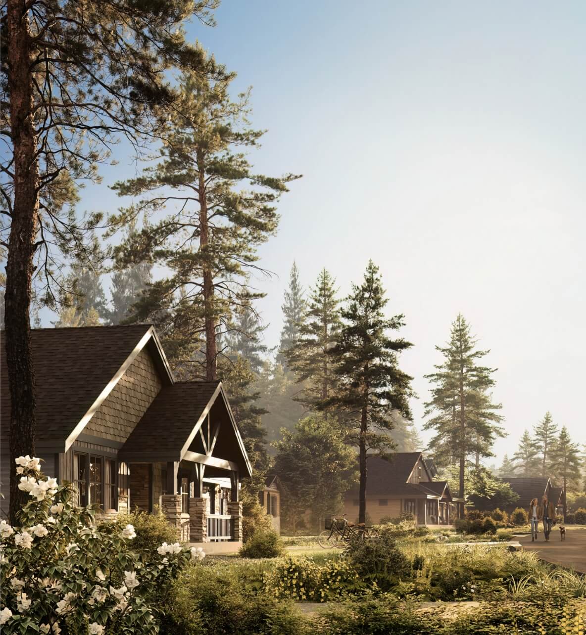 Suburban street with cozy Suncadia homes, tall pine trees, and blooming flowers under a clear sky. People are walking in the distance, likely heading to charming Cle Elum restaurants nearby.