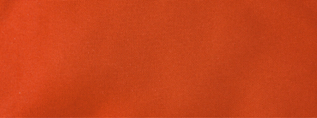 Close-up of a textured, orange fabric with fine horizontal lines running across the surface.