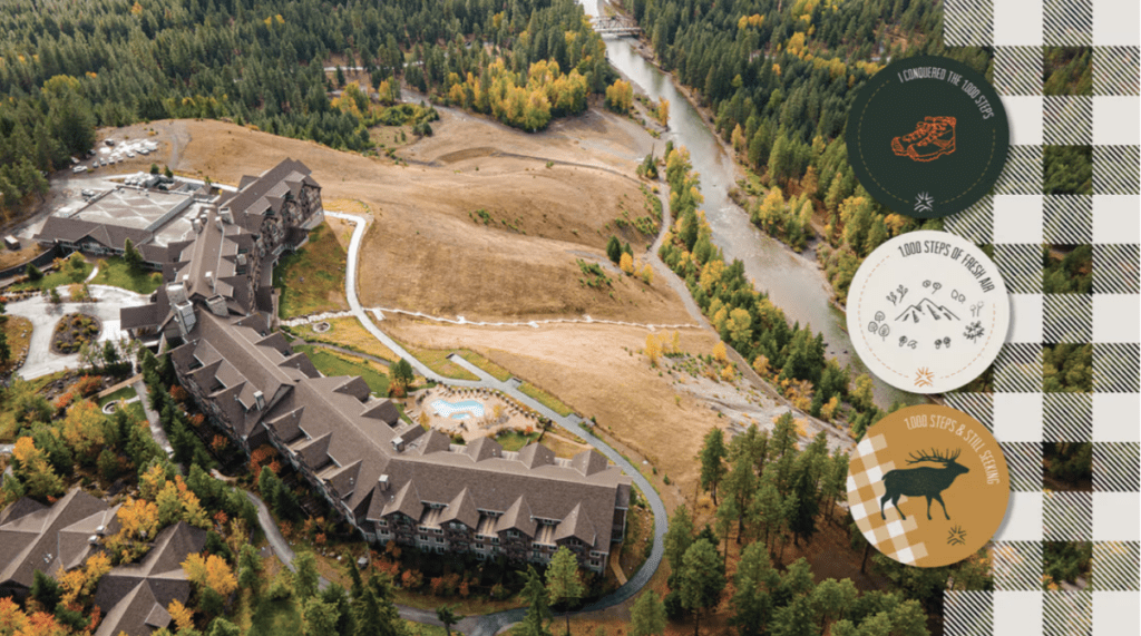 Aerial view of a large lodge surrounded by trees in autumn, next to a winding river. Three circular badges and a plaid pattern are overlaid on the right side of the image.