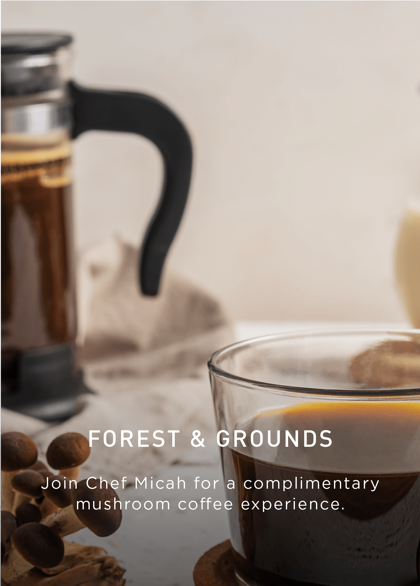 A glass mug of coffee on a coaster beside coffee beans and a French press. Text promotes a complimentary mushroom coffee experience with Chef Micah and includes an Explore button.