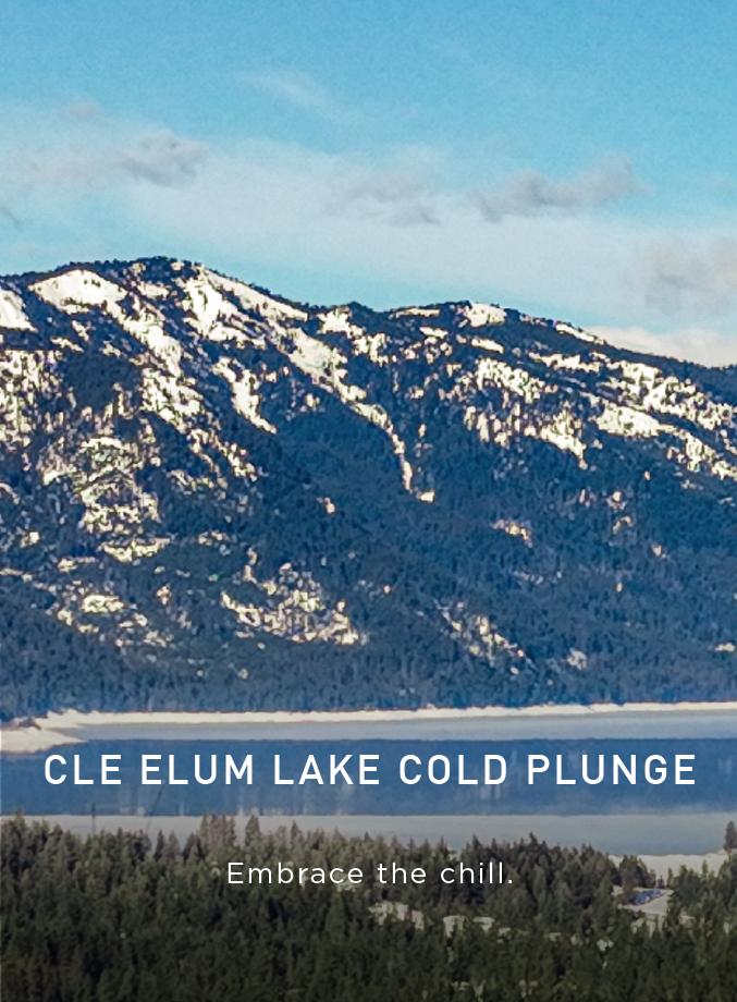 Snow-capped mountains rise above Cle Elum Lake, surrounded by pine trees under a blue sky. Text reads: Cle Elum Lake Cold Plunge. Embrace the chill. A button says Explore Connection..